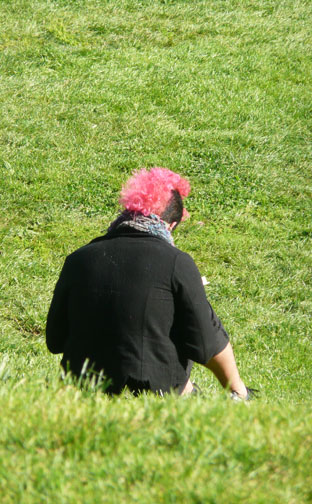 Closeup of person with pink mohawk and black sides