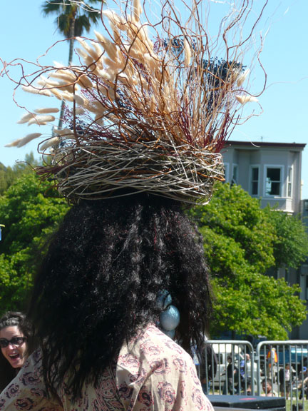 Black person with bird's nest hat