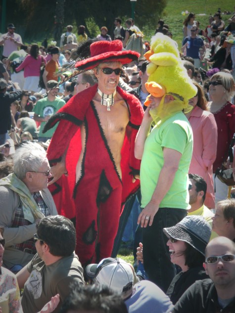 man in red costume with crotch cut out and replaced with fishnet
