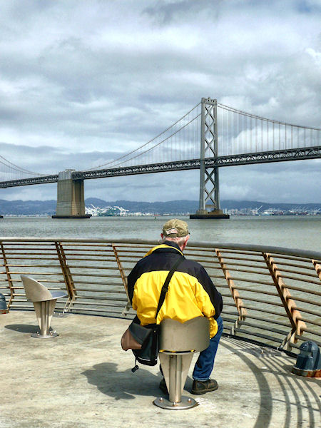 Fine Art Photograph of Thom Terrific sitting on Pier 14 on the Embarcadero in San Francisco