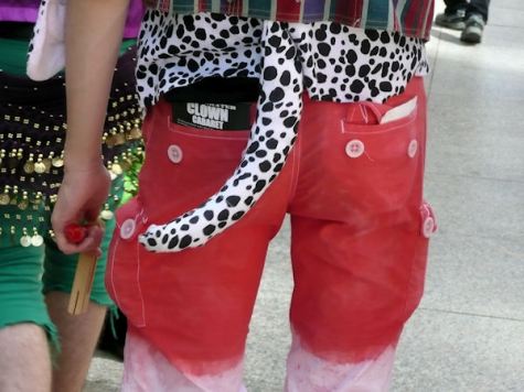 red pants with a black and white leopard tail