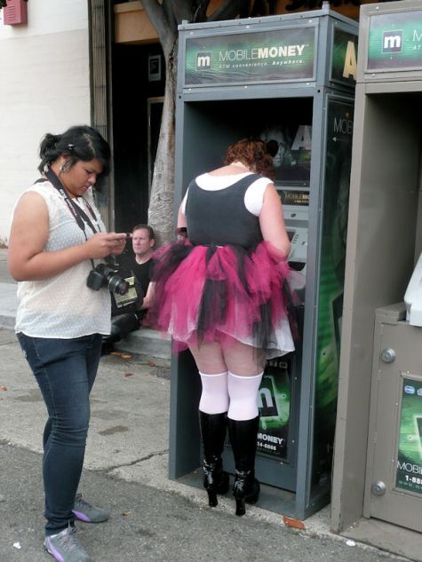 woman in pink tutu at the money machine