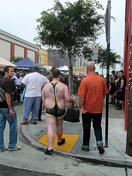 man in fishnet muscle outfit