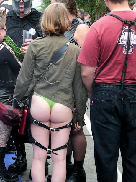 woman in green thong with leather accessories